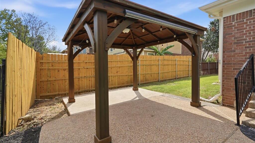 Covered patio as the listing supplied it, unfurnished