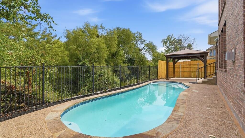 Pool deck as the listing supplied it, unfurnished